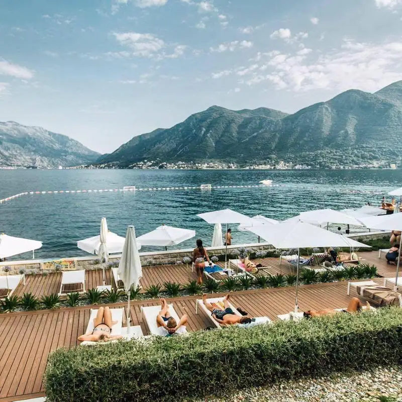 Beach club loungers above the water