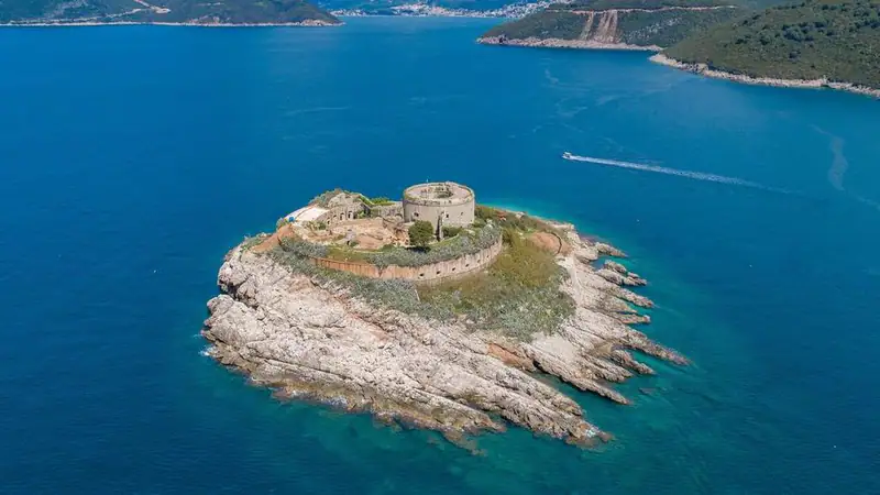 The round fortress island of Mamula at the mouth of the bay